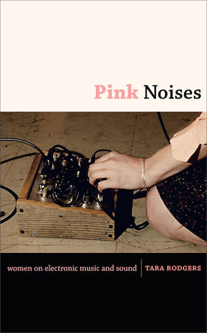 Pink Noises book cover showing the hand of Jessica Rylan playing a synth that she designed.